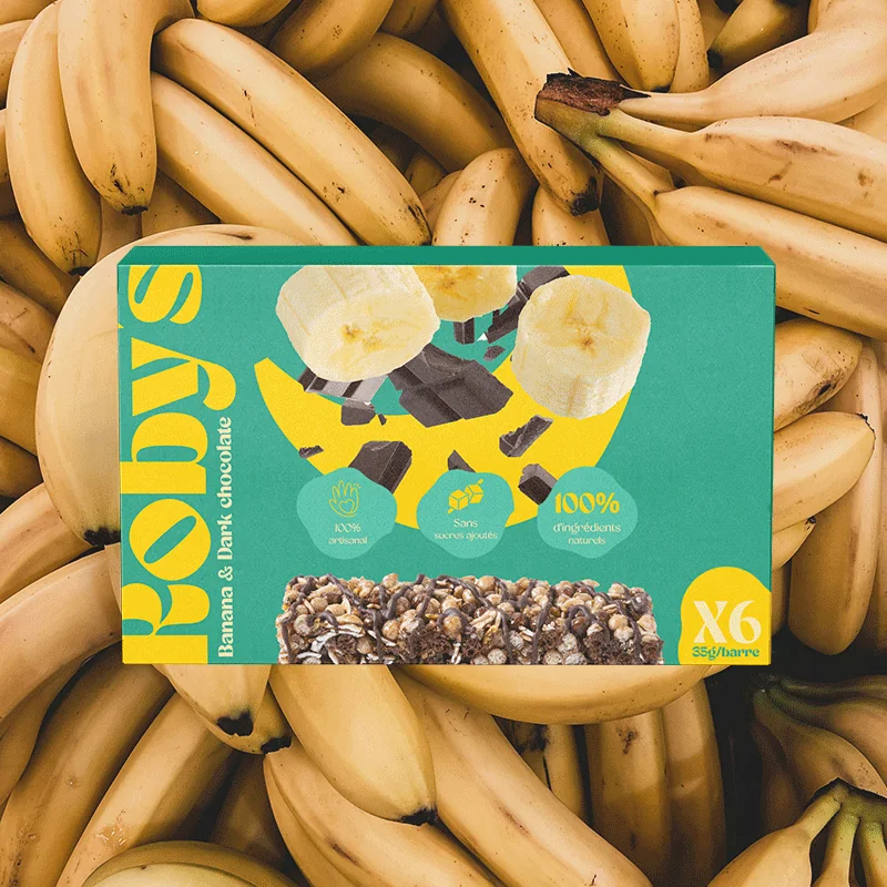 Packaging Roby's Bar, parfum banane et chocolat noir, sur fond de bananes